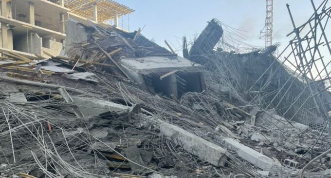 This photo shows the rubble of a collapsed building. 