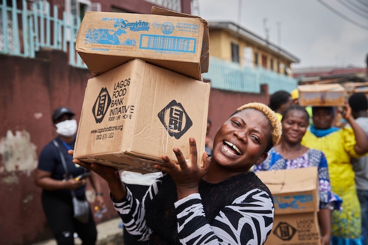 A woman smiles during a Lagos Food Bank drive. Credit: The Lagos Food Bank