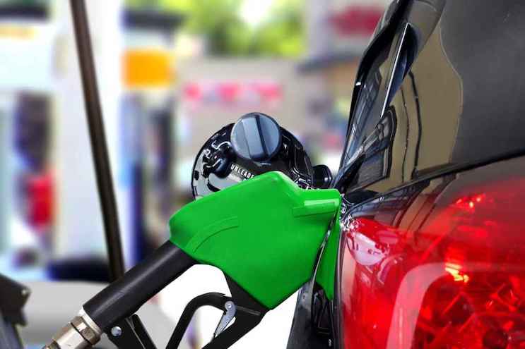 A file photo of a fuel pump refilling a car.