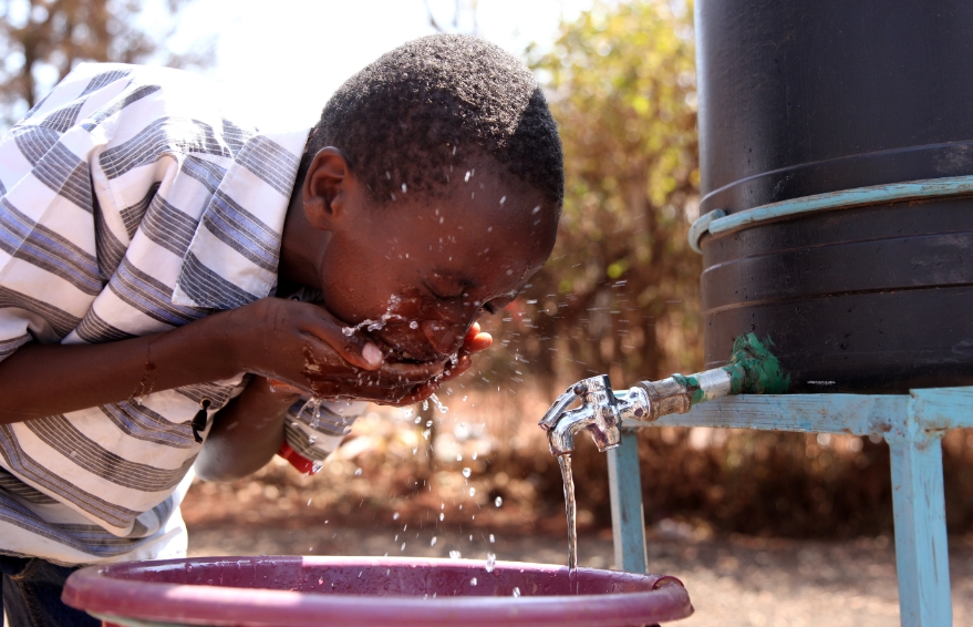 A boy drinking borehole water. Credit: FRCN HQ