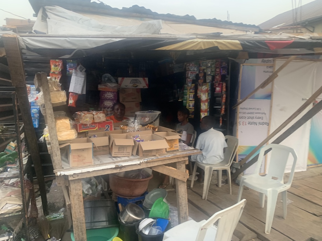 Mama Aisha at her provision store in Kokumo.